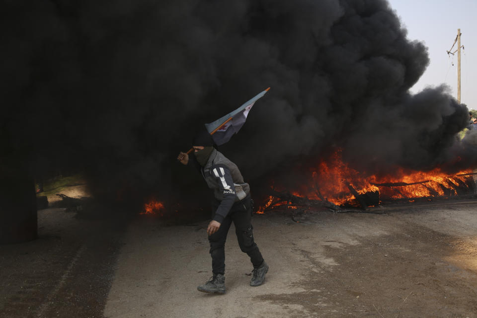 Syrians block main highway in Neyrab, Sunday, March 15, 2020 as they protest agreement on joint Turkish and Russian patrols in northwest Syria. Patrols on the M4 highway, which runs east-west through Idlib province, are part of a cease-fire agreed between Turkey and Russia after an escalation in fighting that saw the Turkish military in direct conflict with Syrian government troops.( AP Photo)