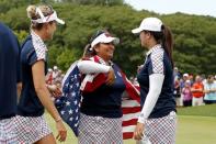 Aug 20, 2017; West Des Moines, IA, USA; USA golfers Lexi Thompson, Lizette Salas and Angel Yin celebrate on the 18th green during the final round of The Solheim Cup international golf tournament at Des Moines Golf and Country Club. Mandatory Credit: Brian Spurlock-USA TODAY Sports