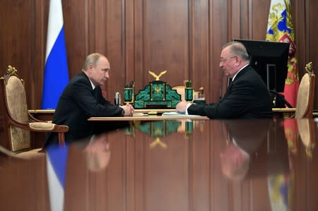 FILE PHOTO: Russia's President Vladimir Putin meets chief executive of Russian oil pipeline monopoly Transneft Nikolai Tokarev in Moscow