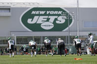 New York Jets wide receiver's Matt Cole (19), Manasseh Bailey (3), Jeff Smith (16) and D.J. Montgomery (14) line up to run a drill during NFL football practice Wednesday, July 28, 2021, in Florham Park, N.J. (AP Photo/Adam Hunger)