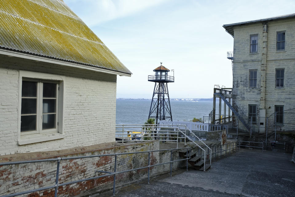 In this photo taken Tuesday, Nov. 12, 2019, a guard tower stands near the main dock on Alcatraz Island in San Francisco. The week of Nov. 18, 2019, marks 50 years since the beginning of a months-long Native American occupation at Alcatraz Island in the San Francisco Bay. The demonstration by dozens of tribal members had lasting effects for tribes, raising awareness of life on and off reservations, galvanizing activists and spurring a shift in federal policy toward self-determination. (AP Photo/Eric Risberg)