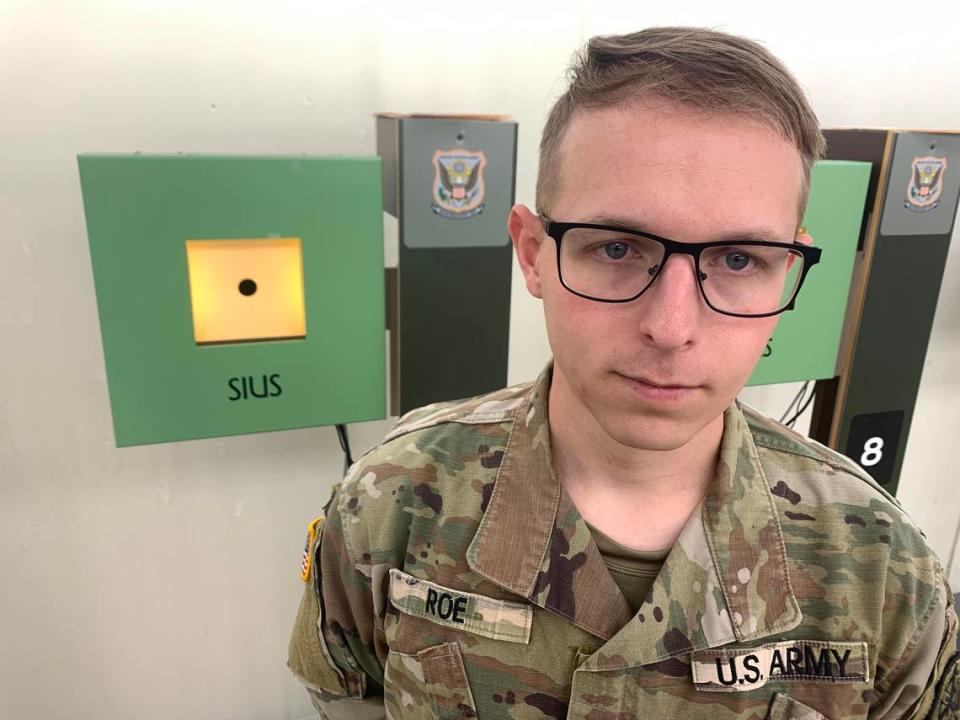 Sgt. Ivan Roe stands in front of 10 meter air rifle targets at a training facility located at Fort Moore. Roe recently made Team USA for the 2024 Olympics. He will be competing in the 10 meter air rifle event. Kelby Hutchison/Photo by Kelby Hutchison.