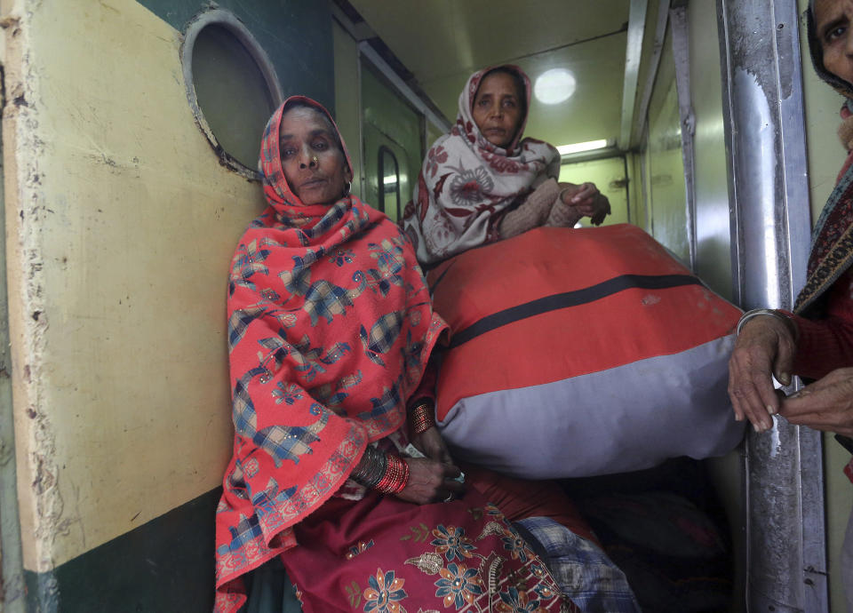 Passengers onboard a train on their way back to India, after being stranded in Pakistan for a week, at Lahore Railway Station in Pakistan, Monday, March 4, 2019. A Pakistani railways official says a key train service between Pakistan and neighbouring India has been resumed, a sign on easing tensions between the two South Asian nuclear-armed rivals. (AP Photo/K.M. Chaudary)