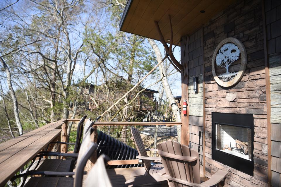 Treehouses at the new Sanctuary Treehouse Resort feature outdoor seating and fireplaces.