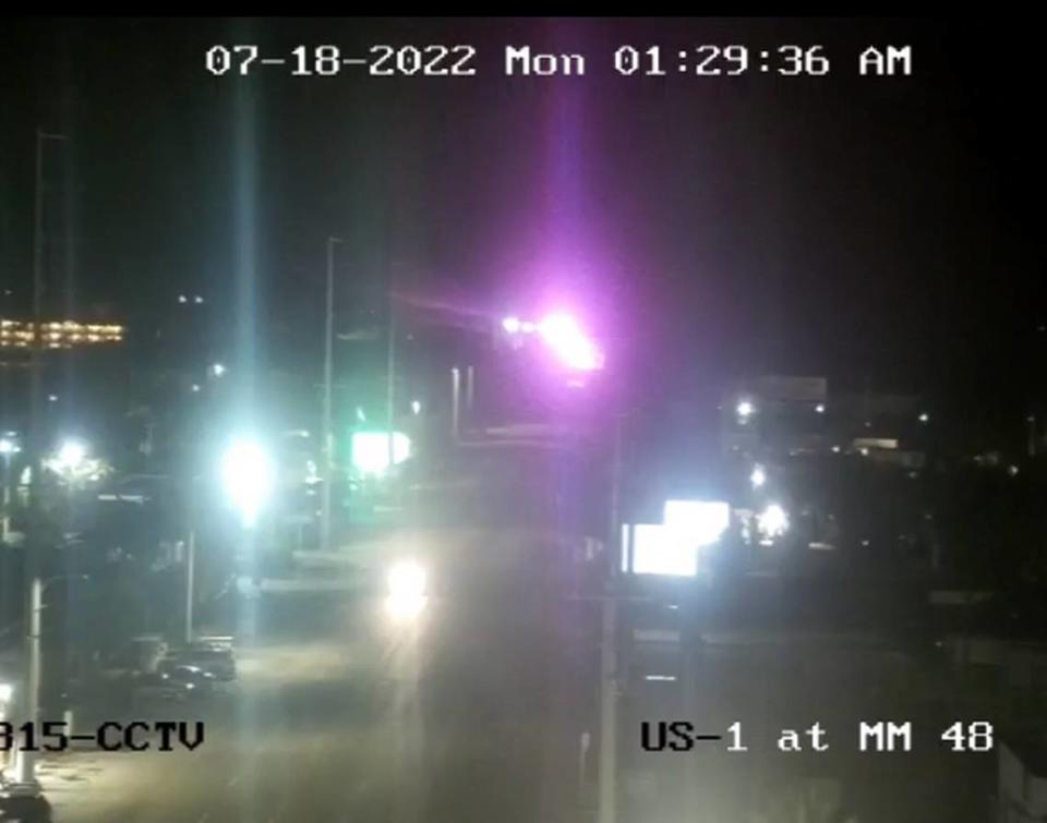 A Florida Department of Transportation camera shows the flashing lights of rescue vehicles on the Seven Mile Bridge in the Middle Florida Keys early Monday morning, July 18, 2022. One person was killed in a car crash on the bridge, the largest span in the Keys.