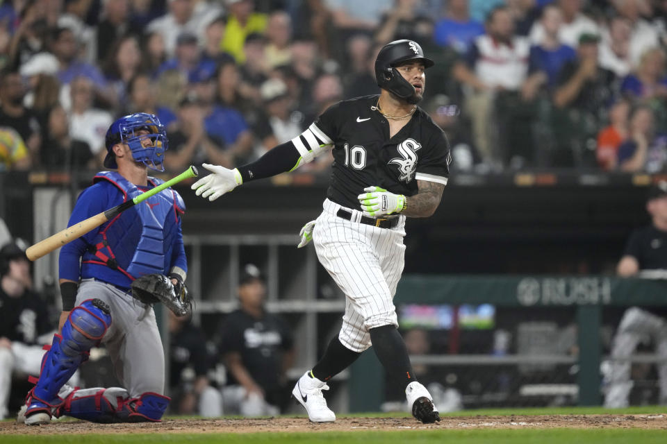 Chicago White Sox's Yoán Moncada watches his RBI sacrifice fly off Chicago Cubs starting pitcher Kyle Hendricks during the seventh inning of a baseball game, Tuesday, July 25, 2023, in Chicago. (AP Photo/Charles Rex Arbogast)