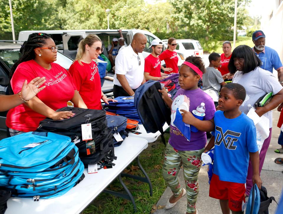 Kids receive backpacks during the 19th Annual Stop the Violence Back to School Rally held at Santa Fe College gym in Gainesville July 28, 2018. [Brad McClenny/The Gainesville Sun]
(Credit: Gainesville Sun file photo by Brad McClenny)