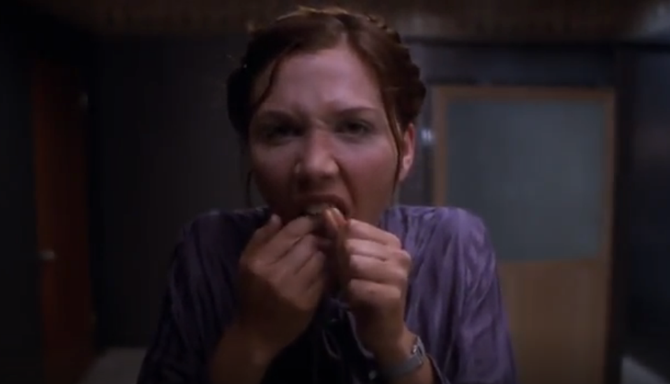 Maggie Gyllenhaal flossing her teeth in "Secretary"