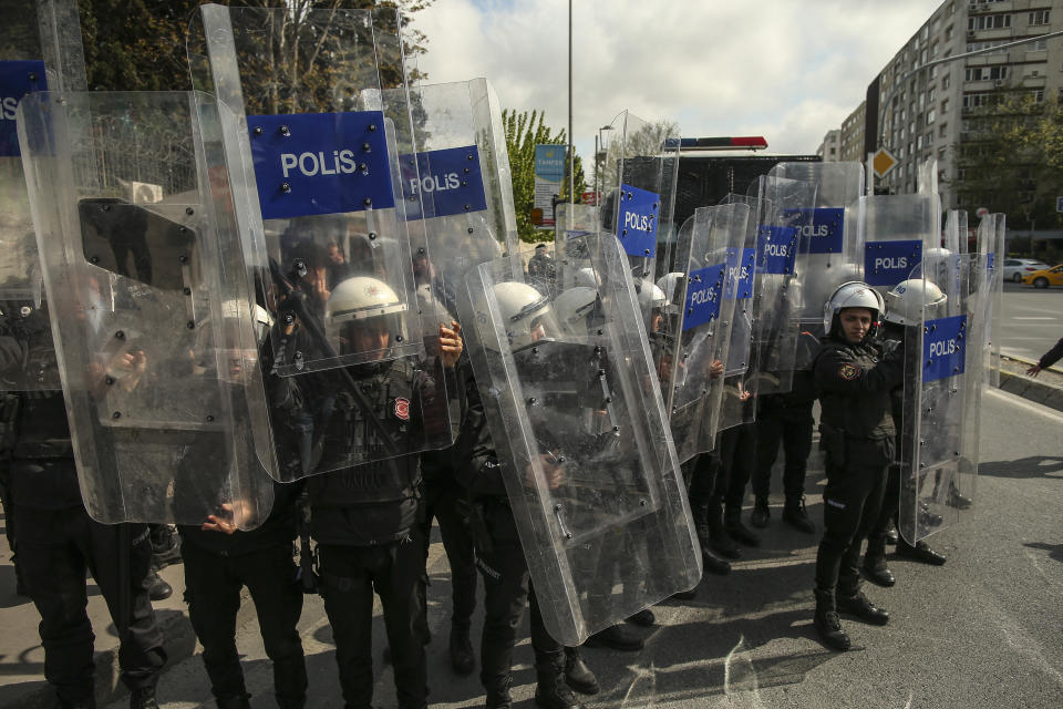 Turkish riot police officers hold up their shields during a May Day protest in Istanbul, Turkey, Sunday, May 1, 2022. May Day is a time of high emotion for participants and their causes, with police on the ready. Turkish police moved in quickly in Istanbul and encircled protesters near the barred-off Taksim square "" where 34 people were killed In 1977 during a May Day event when shots were fired into the crowd from a nearby building. (AP Photo/Emrah Gurel)
