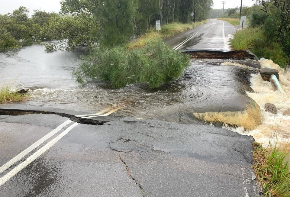 Foreshore Drive at Corlette destroyed by floodwaters.