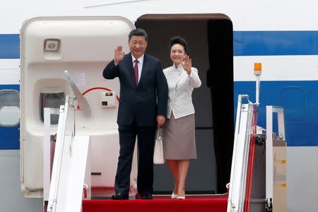 Chinese President Xi Jinping and his wife Peng Liyuan arrive at the airport in Hong Kong, China, ahead of celebrations marking the city's handover from British to Chinese rule, June 29, 2017. REUTERS/Bobby Yip