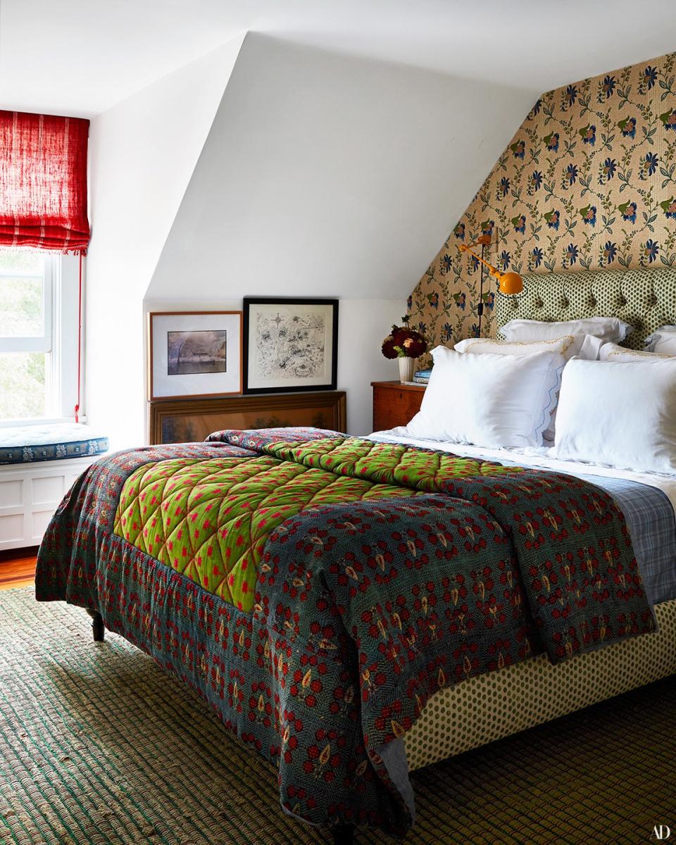 In the master bedroom, a Lisa Fine textiles linen covers a custom bed by RP Miller. Custom coverlet by RP Miller; Schweitzer linens; Sister Parish wall covering.