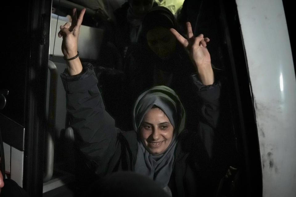Palestinian Lamis Abu Arkoub is greeted after she was released from prison by Israel (AP)