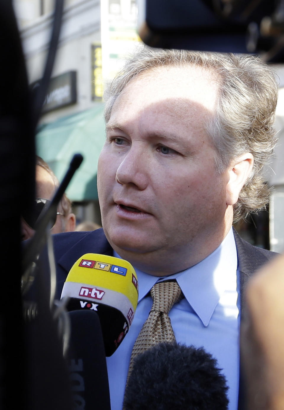 Lawyer John Arthur Eaves, representing a group of Costa Concordia survivors, is interviewed outside Teatro Moderno theater where the first hearing of the trial for the Jan. 13, 2012 tragedy, where 32 people died after the luxury cruise Costa Concordia was forced to evacuate some 4,200 passengers after it hit a rock while passing too close to the Giglio Island, is taking place, in Grosseto, Italy, Monday Oct. 15, 2012. (AP Photo/Gregorio Borgia)