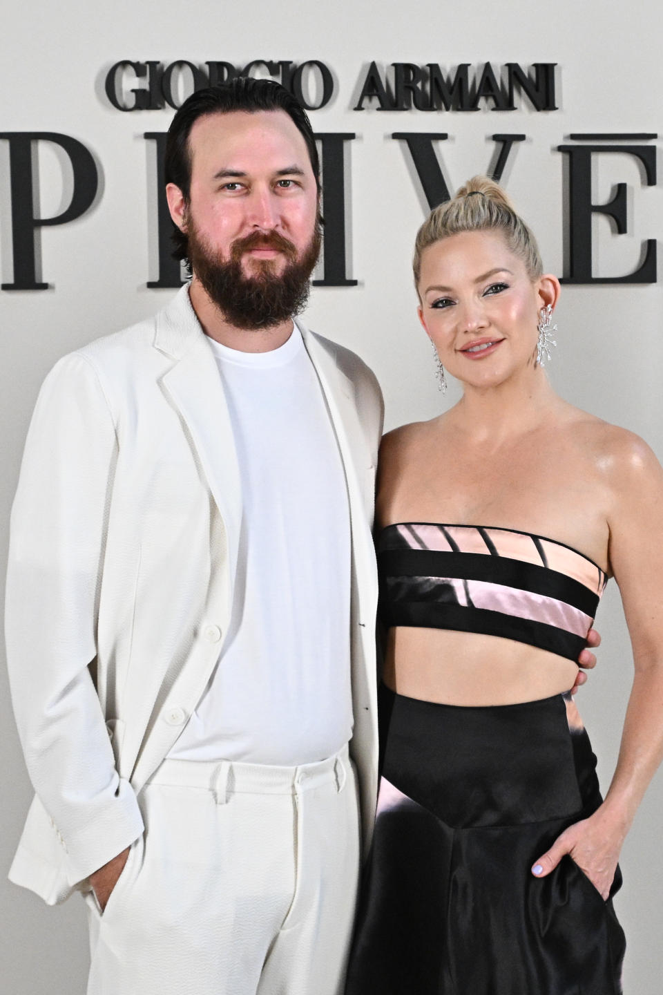 PARIS, FRANCE - JULY 04: (EDITORIAL USE ONLY - For Non-Editorial use please seek approval from Fashion House) Danny Fujikawa and Kate Hudson attend the Giorgio Armani Privé Haute Couture Fall/Winter 2023/2024 show as part of Paris Fashion Week  on July 04, 2023 in Paris, France. (Photo by Stephane Cardinale - Corbis/Corbis via Getty Images)