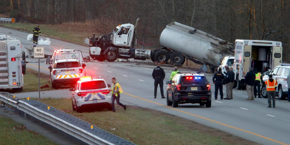 Emergency personnel surround a gasoline tanker that overturned on Route 18 southbound, south of Gordons Corner Road, in Marlboro Township Tuesday afternoon, December 12, 2023. One victim was transported from the scene by a medevac helicopter.