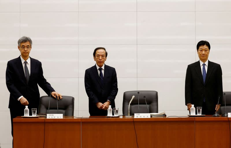 FILE PHOTO: New Bank of Japan Governor Kazuo Ueda and Deputy Governors Ryozo Himino and Shinichi Uchida attend a news conference at the bank headquarters in Tokyo