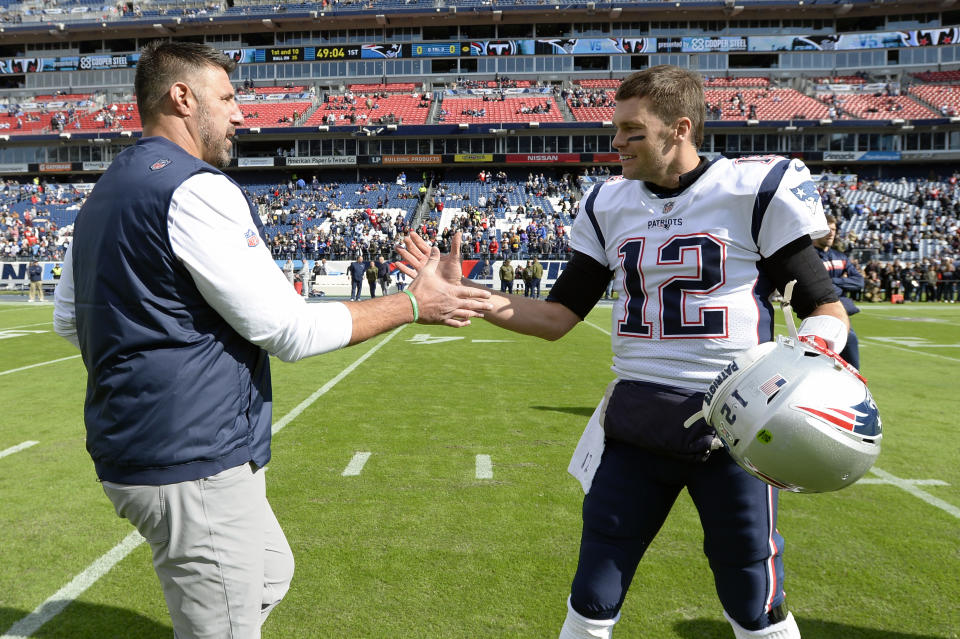 Tennessee Titans head coach Mike Vrabel greets New England Patriots quarterback Tom Brady.