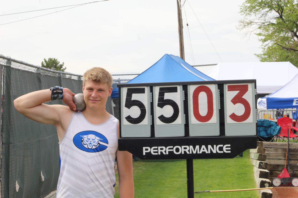 Kyle Bigley, Pueblo Central, stands with his posted distance as the 2022 CHSAA shot put state champion at Jeffco Stadium on May 19, 2022.