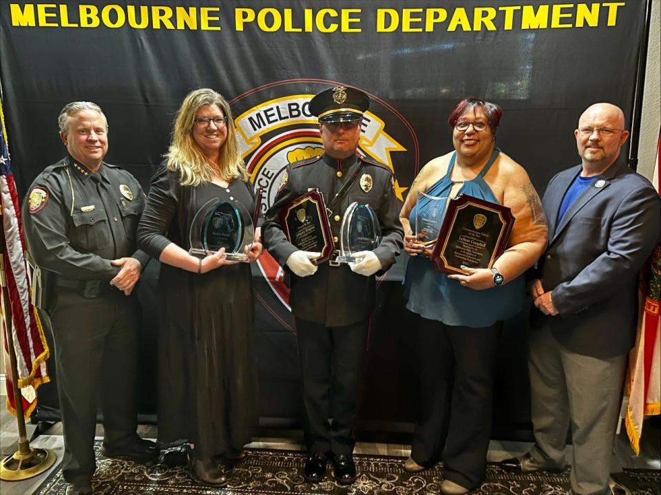 Among those attending the Melbourne Police Department's awards event were, from left, Police Chief David Gillespie, Employee of the Year Sheree Payne, Officer of the Year Greg Hughes, Communications Officer of the Year LeSean Campbell and Melbourne Mayor Paul Alfrey.