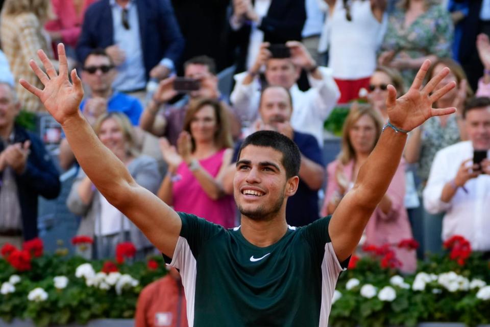 Carlos Alcaraz celebrates after defeating Alexander Zverev in the Madrid Open final (Paul White/AP) (AP)