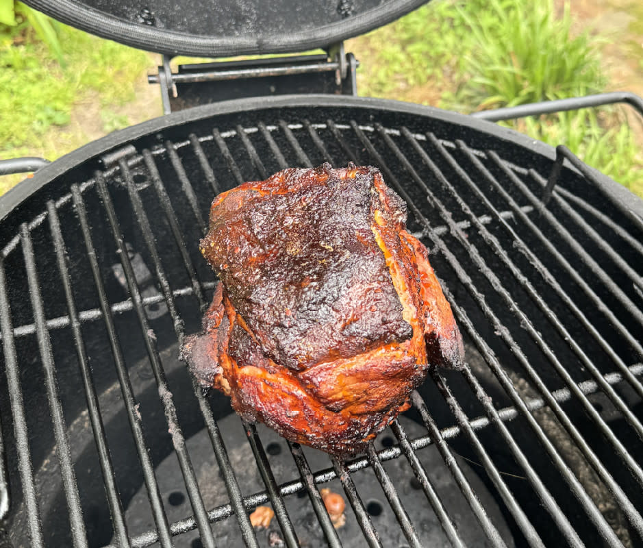 The Oklahoma Joe's heat deflector plate under the grill grate helps keep meat juices from hitting the fire.<p>Adam Bible</p>