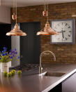 <p> Warm metallic accents are bang on trend for modern country homes, and blend beautifully in a farmhouse scheme, oozing molten warmth across a smoldering palette of burnished brass, rich copper, and oxidized patinas.  </p> <p> Choose brushed finishes on taps, handles, finishes, and kitchen ceiling lighting to soften the overall aesthetic whilst adding an element of refined, yet relaxed luxe.   </p>