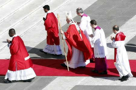 Pope Francis leaves the main altar as he leads the Palm Sunday mass at Saint Peter's Square at the Vatican March 29, 2015. REUTERS/Giampiero Sposito