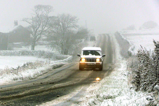 A car travels along a road near Bradfield, north of Sheffield, covered in snow after a cold snap hit parts of the United Kingdom over night. PRESS ASSOCIATION Photo. Picture date: Wednesday November 9, 2016. See PA story WEATHER Cold. Photo credit should read: Dave Higgens/PA Wire