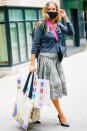 <p>Sarah Jessica Parker grabs a handful of merchandise from her shoe store in midtown N.Y.C. before heading out on Thursday.</p>