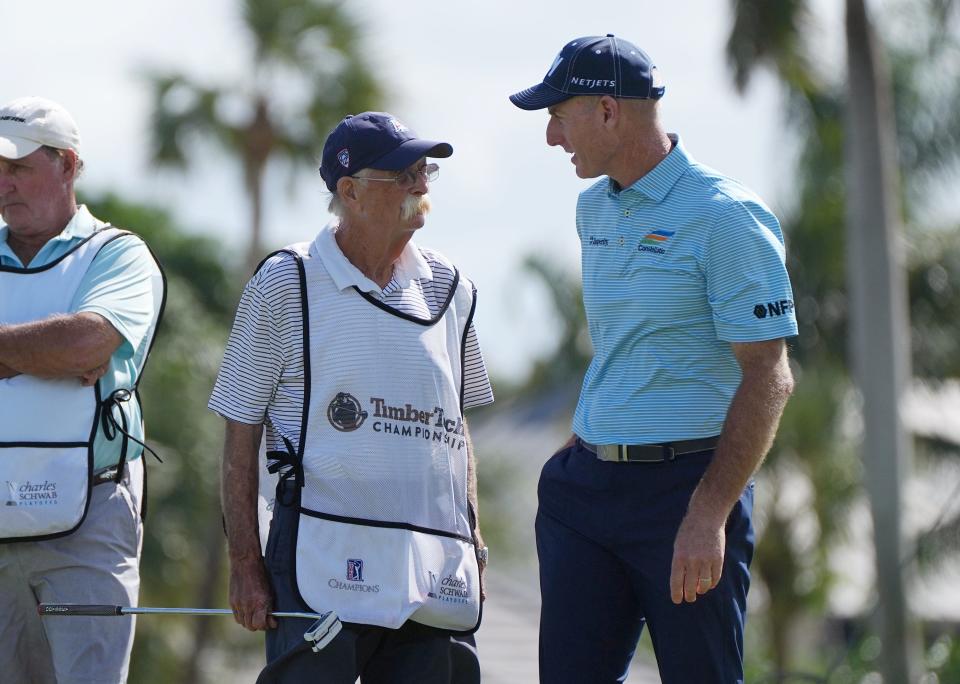 Jim Furyk, right, talks things over with this caddie Michael Thomas “Fluff” Cowan at the 17th hole during the first round of the TimberTech Championship at the Royal Palm Yacht & Country Club in Boca Raton, FL. Friday, Nov. 4, 2022. [JIM RASSOL/palmbeachpost.com]