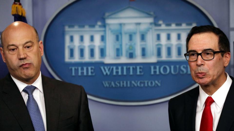 U.S. National Economic Director Gary Cohn (L) and Treasury Secretary Steven Mnuchin react to questions while unveiling the Trump administration's tax reform proposal in the White House briefing room in Washington, U.S, April 26, 2017.