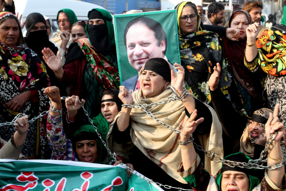 Supporters of former Pakistani Prime Minister Nawaz Sharif protest against a court ruling, in Multan, Pakistan, Monday, Dec. 24, 2018. An anti-graft tribunal sentenced Sharif to seven years in prison for corruption on Monday, drawing criticism from his party, which said the decision was a "black stain" on the justice system. The same court acquitted Sharif in a second case relating to his family's business in Britain. (AP Photo/Asim Tanveer)