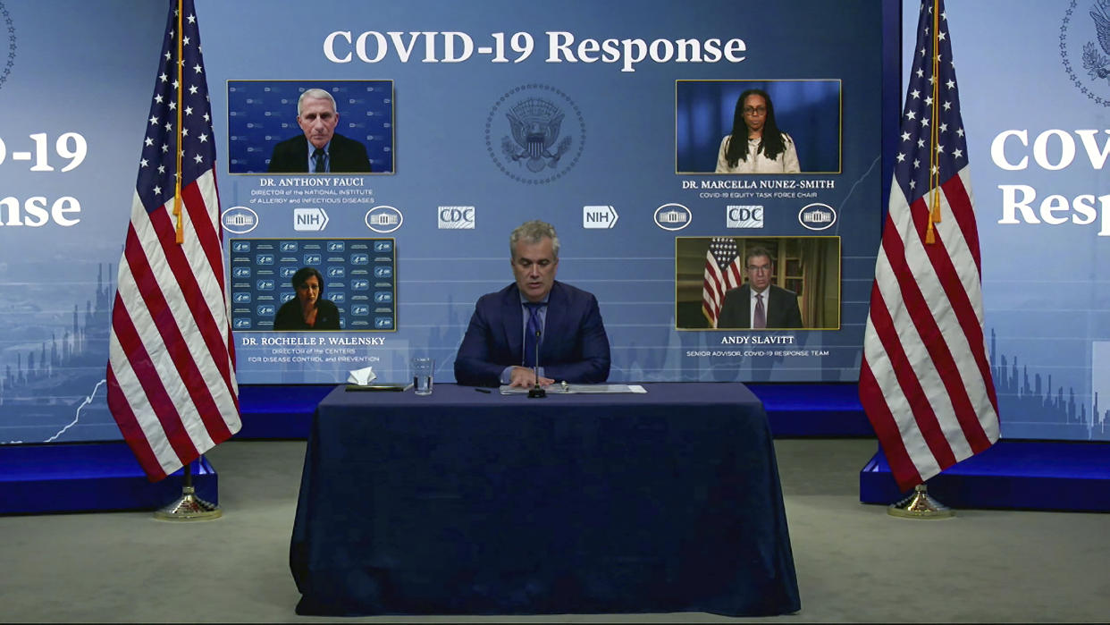 In this image from video,  Jeff Zients, White House coronavirus response coordinator, speaks as Dr. Anthony Fauci, director of the National Institute of Allergy and Infectious Diseases and chief medical adviser to the president., Dr. Marcella Nunez-Smith, chair of the COVID-19 health equity task force, Dr. Rochelle Walensky, director of the Centers for Disease Control and Prevention, and Andy Slavitt, senior adviser to the White House COVID-19 Response Team, appear on screen during a White House briefing on the Biden administration's response to the COVID-19 pandemic Wednesday, Jan. 27, 2021, in Washington. (White House via AP)