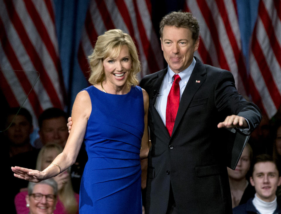 FILE - In this April 7, 2015, file photo Sen. Rand Paul, R-Ky., joined by his wife Kelley Ashby, arrives to announce the start of his presidential campaign at the Galt House Hotel in Louisville, Ky. Rand Paul waited more than a year to disclosure that his wife purchased stock in a company that makes a COVID-19 treatment, an investment made after Congress was briefed on the threat of the virus but before the public was largely aware of its danger. (AP Photo/Carolyn Kaster, File)