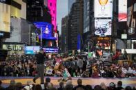 Cuban wrestler Yowlys Bonne Rodriguez slams U.S. wrestler Tony Ramos during their "Salsa in the Square" wrestling match in New York's Times Square, May 21, 2015. REUTERS/Brendan McDermid