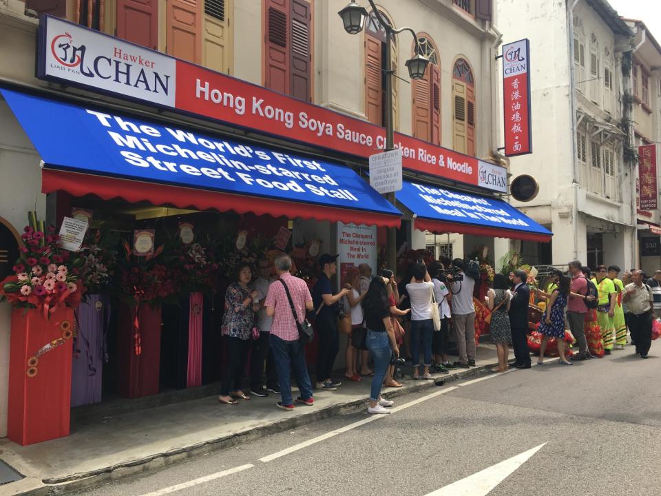 <p>Bold blue, red and white colours make up Hawker Chan’s storefront. </p>