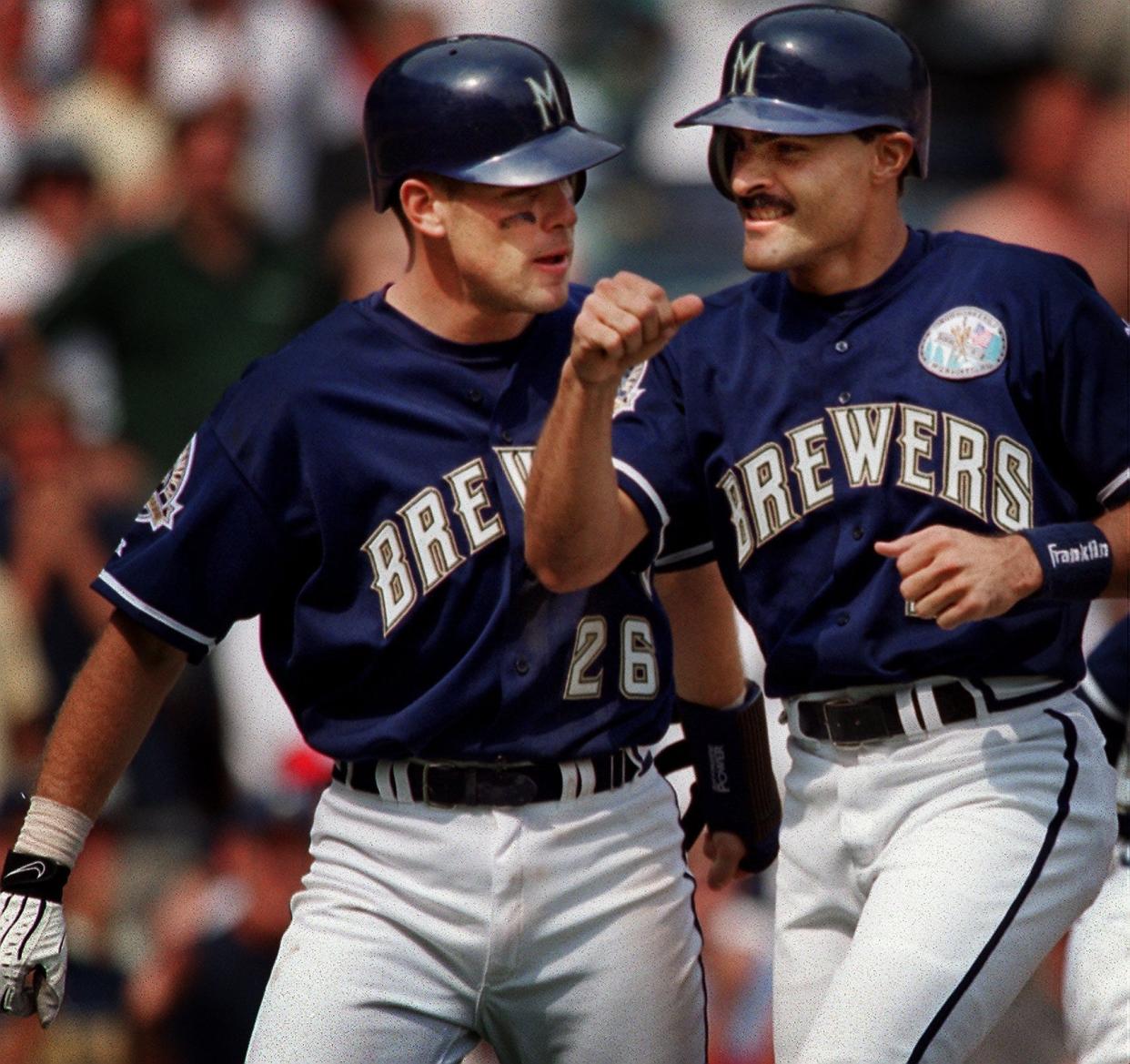 José Valentín (right) reacts to his sixth-inning grand slam home run with teammate Jeff Cirillo on Aug. 25, 1999.