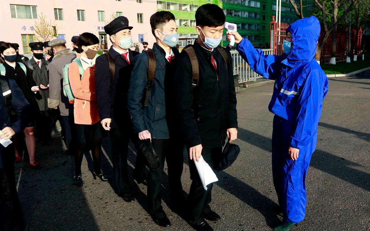 Students in Pyongyang have their temperatures checked  - Jon Chol Jin/AP