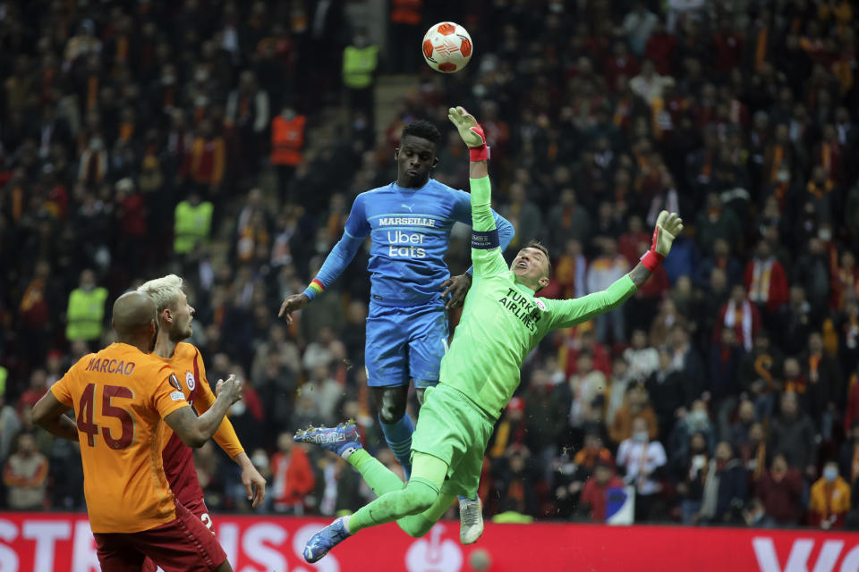 FILE - Galatasaray's goalkeeper Fernando Muslera jumps to block a shot during the Europa League group E soccer match against Olympique de Marseille, in Istanbul, Turkey, Nov. 25, 2021. Muslera, who played in the past four World Cups, announced his retirement from international soccer on Thursday, April 25, 2024. (AP Photo, File)