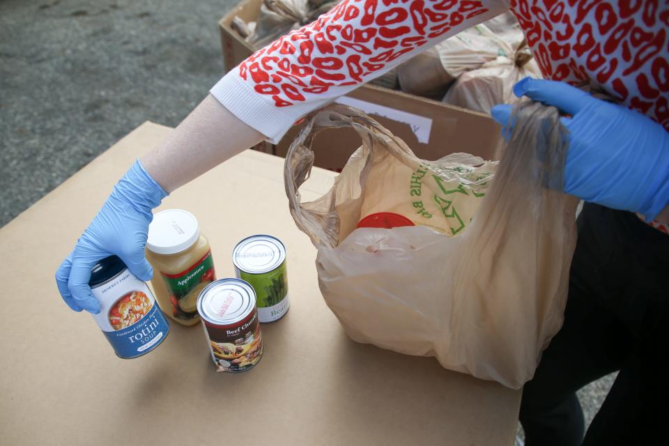 Second Harvest of the Big Bend CEO Monique Ellsworth goes through what is inside each of the 500 supplemental food kits being distributed by Second Harvest of the Big Bend at Godby High School Tuesday, March 24, 2020. 