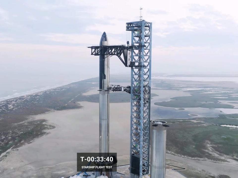 Starship is shown on its launchpad minutes before launch