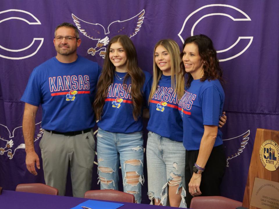 Canyon's Abree Winfrey (center right) poses with her family after signing her national letter of intent to run track for the University of Kansas on Thursday, December 1, 2022 at Canyon High School.