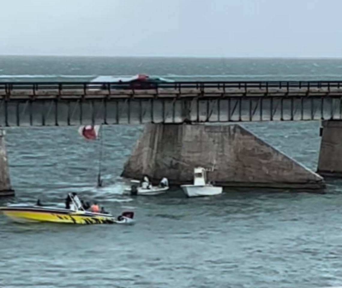A photo from the Seven Mile Bridge in the Florida Keys shows a parasail draped on the old Seven Mile Bridge Monday, May 30, 2022. A woman was killed that day after the parasail was cut loose, then dragged her across the water and slammed into the bridge, authorities said.