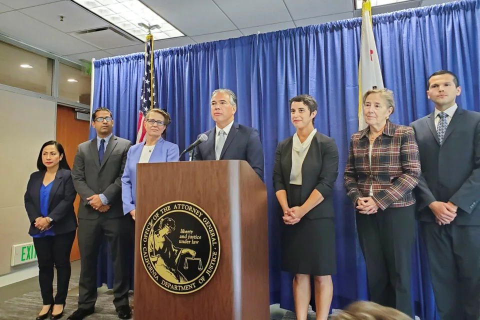 California Attorney General Rob Bonta, at lectern and flanked by staff, announces an antitrust lawsuit against Amazon.com Inc during a news conference in San Francisco, California, U.S. September 14, 2022. REUTERS/Paresh Dave