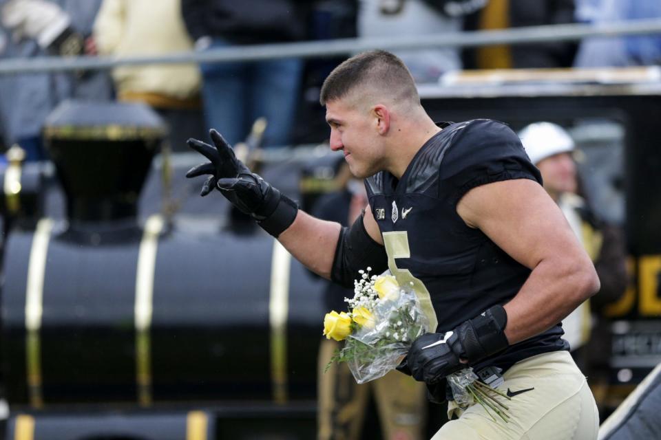 Purdue defensive end George Karlaftis (5) is recognized during a senior day program, Saturday, Nov. 27, 2021 at Ross-Ade Stadium in West Lafayette.