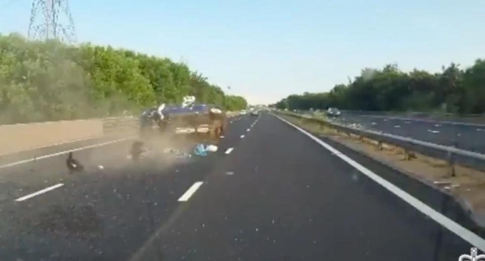 The car crashes on the motorway after it spins out of control and is sent flying through the air. Source: South Wales Police