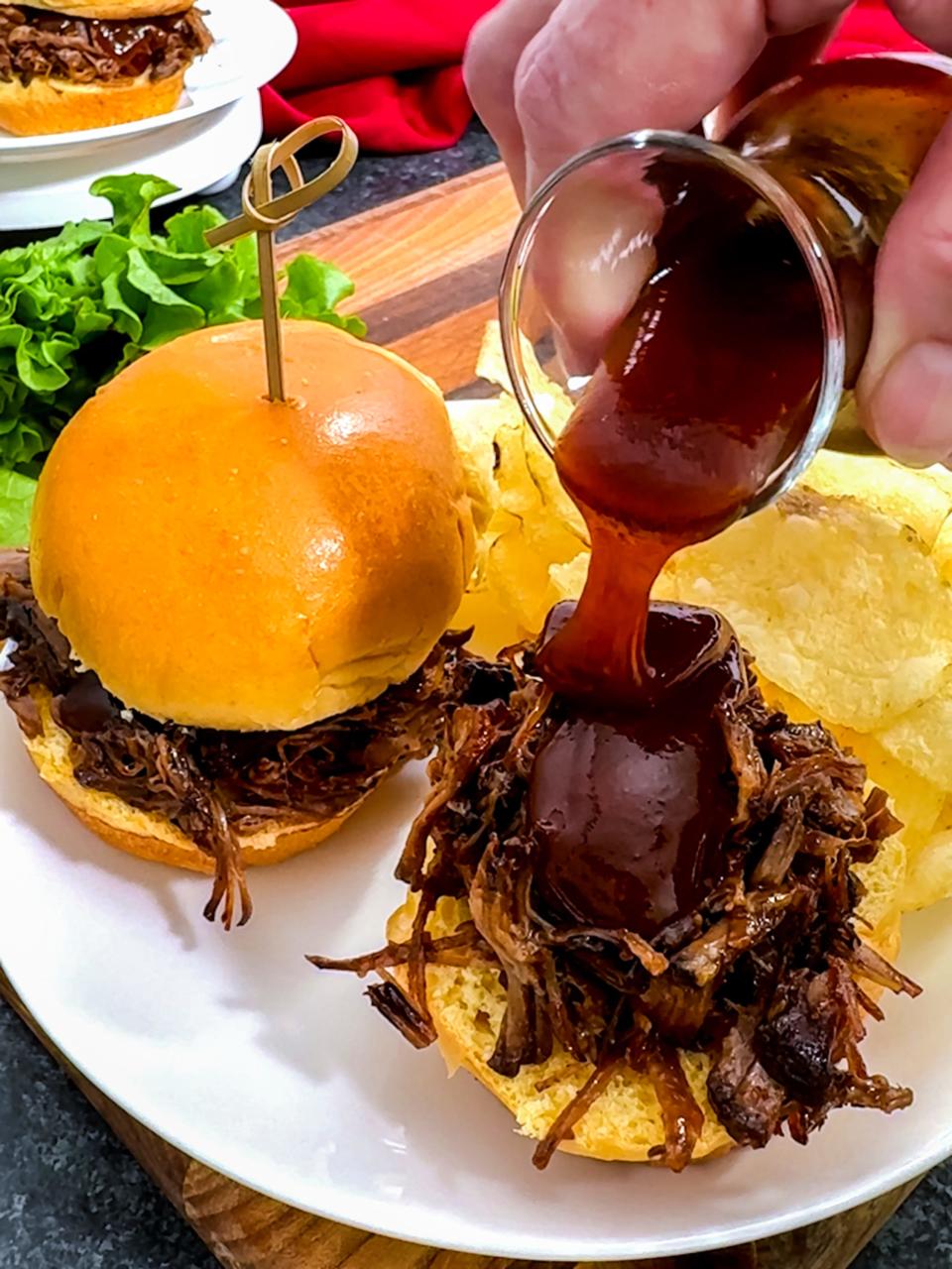 The shredded barbecue beef can be made ahead of time and piled high on the slider buns with some added barbecue sauce right before serving.