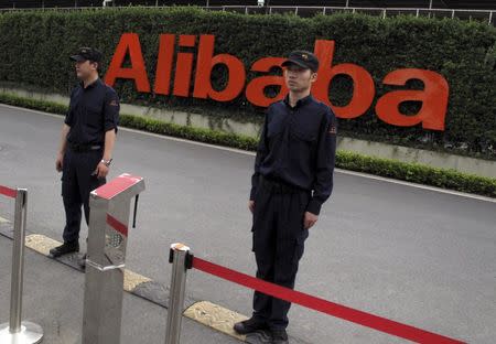 Guards stand near an entrance to Alibaba's headquarters in Hangzhou, Zhejiang province, China, in the May 18, 2015 file picture. REUTERS/John Ruwitch/Files