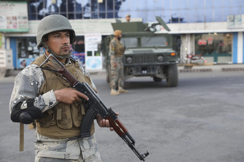 Afghan soldiers stand guard near a polling station in Kabul, Afghanistan, Saturday, Sept. 28, 2019. Afghans headed to the polls on Saturday to elect a new president amid high security and Taliban threats to disrupt the elections, with the rebels warning citizens to stay home or risk being hurt. (AP Photo/Ebrahim Nooroozi)